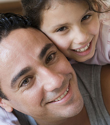 smiling man and daughter